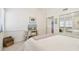 Bright bedroom with white walls, mirrored closet doors, and charming coastal decor at 531 Sandy Hook Rd, Treasure Island, FL 33706