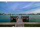 Private dock featuring seating and a peaceful waterfront view at 531 Sandy Hook Rd, Treasure Island, FL 33706