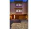 A home exterior with a door to the left and a two-car garage with a light on at 531 Sandy Hook Rd, Treasure Island, FL 33706