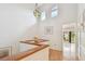 Bright hallway featuring hardwood floors, high ceilings, and an art glass chandelier at 531 Sandy Hook Rd, Treasure Island, FL 33706