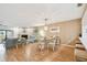 Open concept living room with decorative fireplace, modern furniture, and laminate wood flooring at 531 Sandy Hook Rd, Treasure Island, FL 33706