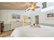 Light-filled bedroom featuring a vaulted ceiling, balcony access, and decorative golf clubs at 531 Sandy Hook Rd, Treasure Island, FL 33706