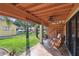 Covered patio featuring tile flooring, patio furniture, and a spiral staircase at 531 Sandy Hook Rd, Treasure Island, FL 33706