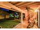 Covered patio with seating, ceiling fan, and spiral staircase, perfect for relaxing outdoors at 531 Sandy Hook Rd, Treasure Island, FL 33706