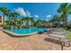 Inviting community pool with lounge seating and lush landscaping at 531 Sandy Hook Rd, Treasure Island, FL 33706