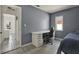 This bedroom has a desk and chair beside a window with a view at 5875 Darren N Ct, Clearwater, FL 33760