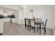 The dining room showcases tile floors and flows into the kitchen area at 5875 Darren N Ct, Clearwater, FL 33760