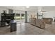 Spacious living room with tile floors, slider to backyard, and neutral decor at 5875 Darren N Ct, Clearwater, FL 33760