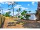 Backyard view showing mature trees and natural features with fencing at 6120 5Th N Ave, St Petersburg, FL 33710