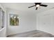 Clean, minimalist bedroom featuring a ceiling fan, and neutral colors at 6120 5Th N Ave, St Petersburg, FL 33710