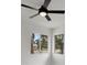 Bright bedroom with ceiling fan and windows offering outdoor views at 6120 5Th N Ave, St Petersburg, FL 33710