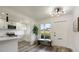 Bright and airy kitchen featuring modern white cabinets, stainless appliances, and a cozy breakfast nook at 6120 5Th N Ave, St Petersburg, FL 33710