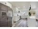 Bright kitchen features all white cabinets, stainless steel appliances and modern fixtures at 6120 5Th N Ave, St Petersburg, FL 33710