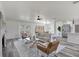 Open living room and dining space boasts fireplace, hardwood floors and natural light at 6120 5Th N Ave, St Petersburg, FL 33710