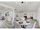 Open-concept living space with fireplace, hardwood floors and recessed lighting at 6120 5Th N Ave, St Petersburg, FL 33710