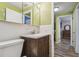 Cozy bathroom features a vanity with wood cabinets and a tiled backsplash at 6246 Bandura Ave, New Port Richey, FL 34653