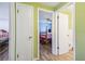 Hallway view into bedroom and bathroom, showcasing floor plan layout at 6246 Bandura Ave, New Port Richey, FL 34653