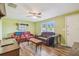 Cozy living room area with lots of seating and a ceiling fan at 6246 Bandura Ave, New Port Richey, FL 34653