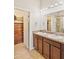 Bathroom vanity features double sinks and tile flooring at 6912 40Th N Ln, Pinellas Park, FL 33781