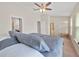 Bright bedroom features a ceiling fan and neutral walls at 6912 40Th N Ln, Pinellas Park, FL 33781