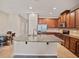 Spacious kitchen with granite countertops, stainless-steel appliances, and a central island at 6912 40Th N Ln, Pinellas Park, FL 33781