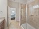 Tiled shower with glass door and a view of bedroom at 6912 40Th N Ln, Pinellas Park, FL 33781