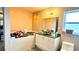 Bathroom featuring a tub, vanity, and toilet at 7012 Pin Cherry Ln, Port Richey, FL 34668