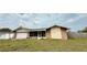 Ranch-style home featuring an attached two-car garage and a screened-in patio at 7012 Pin Cherry Ln, Port Richey, FL 34668