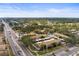 Aerial view of community, showcasing landscaping and nearby streets at 7606 Woodbridge Blvd, Tampa, FL 33615