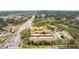Aerial view showing the property, street access, and landscape at 7606 Woodbridge Blvd, Tampa, FL 33615