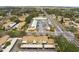 Overhead view of property and parking with busy street access at 7606 Woodbridge Blvd, Tampa, FL 33615