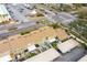 Aerial view of townhomes with parking spaces and landscaped yards at 7606 Woodbridge Blvd, Tampa, FL 33615