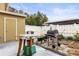 Cozy backyard featuring a grill, storage and patio area at 7606 Woodbridge Blvd, Tampa, FL 33615