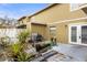 Exterior view of backyard with a grill, and direct access to house at 7606 Woodbridge Blvd, Tampa, FL 33615