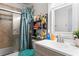 Bathroom featuring a tub, shower, and ample storage at 7606 Woodbridge Blvd, Tampa, FL 33615