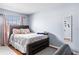 Comfortable bedroom with wood floors, stylish furnishings, and a bright window at 7606 Woodbridge Blvd, Tampa, FL 33615