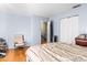 Bedroom featuring a chair, a closet, and neutral paint at 7606 Woodbridge Blvd, Tampa, FL 33615