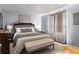 Comfortable bedroom features a large window and bench at 7606 Woodbridge Blvd, Tampa, FL 33615