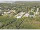 Aerial view of homesite with an in-ground pool, backing up to the mangrove forests at 8117 Bay Dr, Tampa, FL 33635