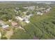 Scenic aerial shot of the home site with a pool, dock, and views of the surrounding waterway at 8117 Bay Dr, Tampa, FL 33635