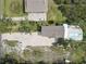 Overhead view of a house with a pool, patio, and long driveway showcasing the property layout at 8117 Bay Dr, Tampa, FL 33635