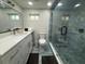 Modern bathroom featuring a sleek vanity, luxurious shower, and contemporary design at 8117 Bay Dr, Tampa, FL 33635