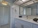 Contemporary bathroom with white marble wall, modern fixtures, and sleek vanity at 8117 Bay Dr, Tampa, FL 33635