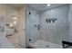 Modern bathroom features a glass walk-in shower with sleek tiling and convenient built-in shower niche at 8117 Bay Dr, Tampa, FL 33635