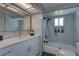 Modern bathroom featuring a bathtub with glass enclosure and sleek fixtures at 8117 Bay Dr, Tampa, FL 33635