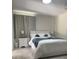 Serene bedroom with soft lighting and comfortable queen bed setting at 8117 Bay Dr, Tampa, FL 33635