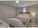 Comfortable bedroom features a queen-sized bed, neutral linens, and soft lighting at 8117 Bay Dr, Tampa, FL 33635
