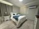 Bright bedroom with a comfortable bed, soft linens, and a cozy atmosphere at 8117 Bay Dr, Tampa, FL 33635