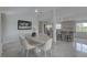 Open concept dining and kitchen area with tiled floors and modern design at 8117 Bay Dr, Tampa, FL 33635