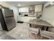 Modern kitchen includes stainless steel appliances and a dining area at 8117 Bay Dr, Tampa, FL 33635